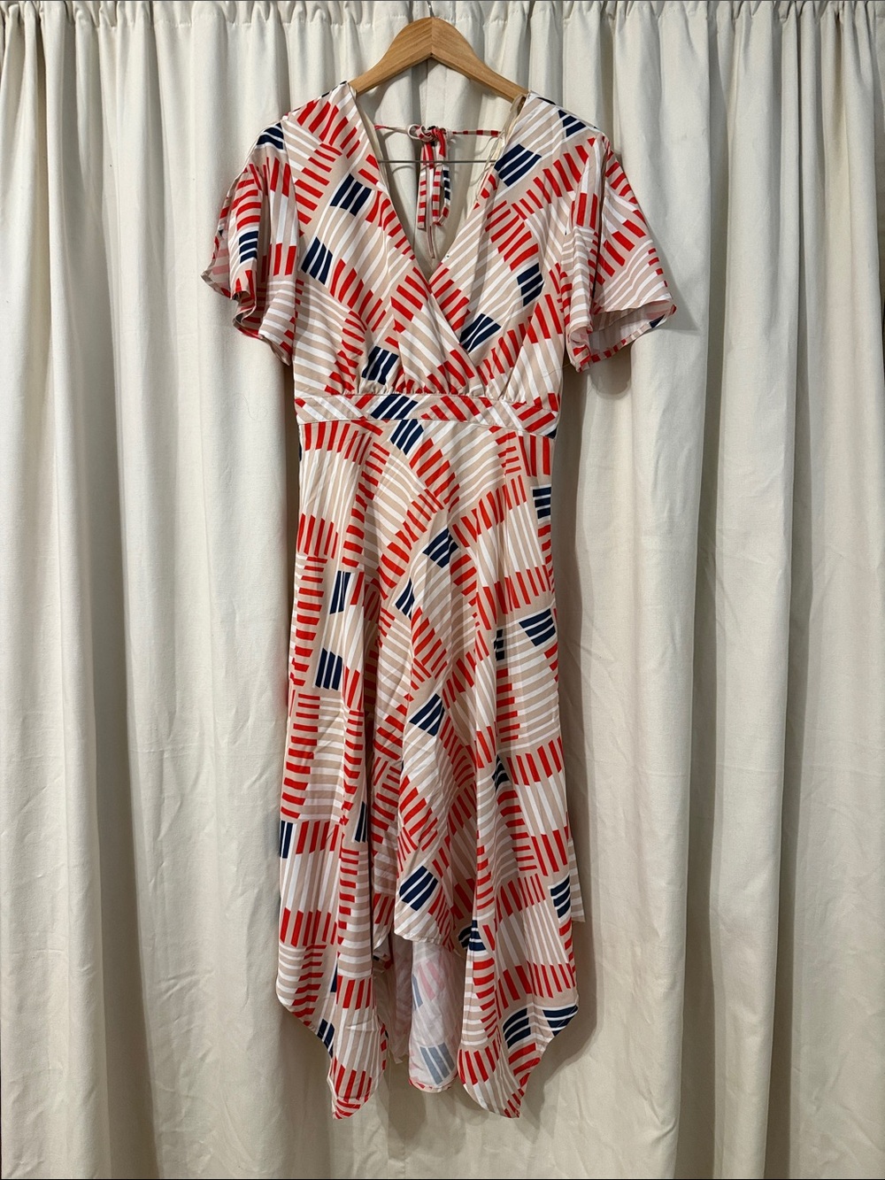 Love Riche Cream Asymmetrical Wrap Dress with Red & Navy Geometric Print